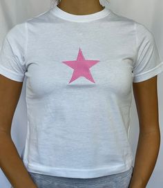 "Star baby tee 100% cotton available in sizes xs - xl - see photo 5 for sizing Model is wearing size S and is a 6/8 - For reference, model is 5'5 with 31\" bust and 26\" waist" Cotton T-shirt With Star Print For Summer, Trendy Summer T-shirt With Star Patch, Summer Cotton T-shirt With Star Patch, Summer Graphic Tee With Star Logo, Graphic Tee With Star Logo For Summer, Crew Neck Tops With Star Logo For Summer, Trendy Fitted Tops With Star Print, Casual Summer Tops With Star Logo, Fitted Star Print T-shirt For Summer