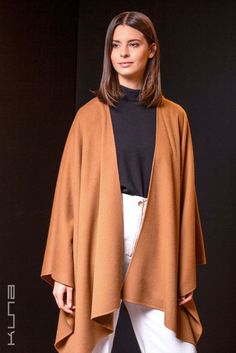 The Camel color is in stock. [3-day delivery within the United States] A classic Long Cape made from 100% Vicuna. The ultimate in elegance and luxury. Vicuna is the finest animal fiber in the world. Extremely light, amazingly soft, and provides unrivaled warmth. Measurements: 63 x 57 7/8 inches This cape comes in a wooden box and includes a hand-numbered and signed card guaranteeing the fiber came from government-controlled shearing operations. Vicunas may only be sheared every two years and pro Brown Luxury Cashmere Outerwear, Luxury Brown Cashmere Outerwear, Elegant Brown Outerwear For Evening, Elegant Brown Evening Outerwear, Elegant Camel Formal Outerwear, Luxury Brown Evening Outerwear, Womens Sweater Coats, Long Cape, Capes & Ponchos