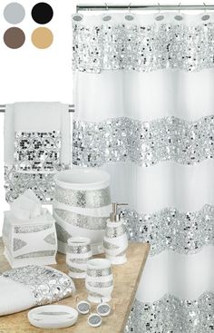 the bathroom is decorated in white and silver colors with sequins on the shower curtain