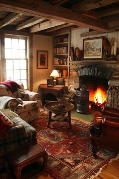 a living room filled with furniture and a fire place in the middle of a room