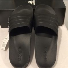 Adidas -Style Name: Adilette Shower -Description:. Unisex Slip-On Sandal/ Shower Slippers/Shoes -Color: Black/Black/Black -Size: Mens 13 /Women's 14 The Picture Has A Tag With A Tag With Size 11 On It, That Is Just Another Size That's Not This Pair. These Are Indeed 13 Mens And 14 Women's -Condition: New With Box Slip-resistant Black Sandals, Black Slip-resistant Sport Sandals With Round Toe, Black Slip-resistant Flat Sandals, Black Fade-resistant Open Toe Slides, Comfortable Fade-resistant Black Sandals, Adidas Non-slip Black Slides, Adidas Black Non-slip Slides, Adidas Black Slip-on Slides, Black Synthetic Sport Sandals