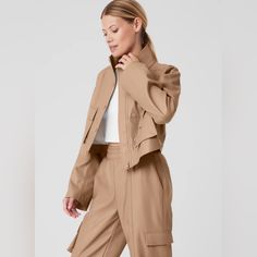 Buttery Soft Faux Leather Crop Jacket And Cargo Style Joggers By Alo Yoga. Really Up Levels Your Joggers Game! Great Travel Set. Beautiful “Toasted Almond” Coloring. New Without Tags, Never Worn. Jacket Size Small, Joggers Size Xsmall. Currently Listed On Alo’s Website At $346 For Both. I Love Love This Set, I’m Just Too Small To Do It Justice:( Trendy Workwear Outerwear With Multiple Pockets, Alo Yoga Fall Outerwear For Work, Alo Yoga Fall Workwear Outerwear, Fall Cropped Jacket With Multiple Pockets Long Sleeve, Workwear Biker Jacket With Flap Pockets, Alo Yoga Long Sleeve Outerwear For Work, Alo Yoga Long Sleeve Workwear Outerwear, Fall Cropped Jacket With Flap Pockets For Work, Spring Casual Alo Yoga Outerwear