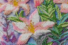 a close up view of some beaded flowers