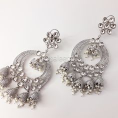 Stylish and exquisite ethnic - South-Asian - Indian - Punjabi - Pakistani - silver uncut polki chandabaali earrings Celebrity silver jhumka Bollywood jewellery long silver chandbaali earrings Jadau cocktail earrings. Perfect gift for Mother's day. Length: 12.5 cms  Width: 5.5 cms  Weight: 102 grams GIFT / PERSONALISED MESSAGE: Please provide the message within the NOTE TO SELLER section if you want to send this item with a GIFT/PERSONALISED MESSAGE CARD. We will follow the instructions and ship Elegant Metal Chandbalis For Festivals, Festive Silver Chandelier Earrings With Tilla, Silver Bridal Earrings With Stone Work For Reception, Elegant Silver Danglers For Reception, Elegant Silver Danglers For Navratri, White Chandbalis With Intricate Design For Festive Occasions, Traditional Silver Chandelier Earrings For Festive Occasions, Elegant White Jewelry For Navratri, Elegant White Chandbalis For Eid