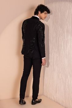 Black full sleeves astron  embroidered tuxedo with tonal sequin embellishments. Paired with a pant. - Aza Fashions Fitted Black Pants For Wedding, Embroidered Fitted Bandhgala For Winter, Fitted Embroidered Pants For Wedding, Embroidered Fitted Pants For Wedding, Evening Long Sleeve Embroidered Suit, Formal Embellished Black Pants, Festive Formal Embellished Pants, Festive Embellished Formal Pants, Fitted Embroidered Wedding Pants