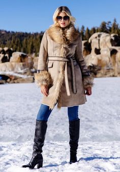 Delivering huge fashion impact with maximum warmth, our Dakota Fox coat SCORES! In luxe Latte vegan suede, the supple, soft hand ensures a fluid, compact silhouette. A luxurious Taupe Fox collar adds lush, plush warmth, along with the bonus of a strong shoulder. Continuing along the center front to the hem, this super-soft fur adds style AND verticality. With Chocolate tipping for authenticity, Taupe Fox is repeated in the adjustable cuffs. Inside a sheared fur lining provides welcome warmth while body-skimming princess seams front and back, provide a lean fit. Bold Chocolate whipstitching accents the flap pockets, sleeve belts, the boundless details and seaming! A tie belt, worn either front or back, pulls together this 37" coat that hints of effortless elegance and quiet confidence. Perf Winter Sheepskin Outerwear For Cold Weather, Sheepskin Outerwear For Cold Winter Weather, Fall Long Pea Coat With Faux Fur Lining, Winter Sheepskin Outerwear With Faux Fur Trim, Chic Fall Wool Coat With Faux Fur Lining, Elegant Sheepskin Outerwear For Fall, Sheepskin Long Coat With Faux Fur Lining, Fitted Sheepskin Outerwear For Fall, Fall Sheepskin Outerwear With Faux Fur Lining