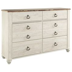 a white dresser with drawers and knobs