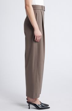 A modern barrel silhouette completes these belted pants cut with just enough stretch to move with you. Zip fly with hook-and-bar closure Removable belt 52% polyester, 42% wool, 6% elastane with 52% polyester, 48% viscose Dry clean Imported High Waist Bottoms With Belt Detail For Work, Modern Wide Leg Pants With Belt Loops For Office, Belted Wide Leg Pants For Work, Modern High Waist Wide Leg Pants With Belt Loops, Modern High-waist Wide Leg Pants With Belt Loops, Elegant Tapered Leg Bottoms With Belt Detail, Workwear Bottoms With Belt And Tapered Leg, Tapered Leg Workwear Bottoms With Belt, Fitted High Waist Bottoms With Belted Cuffs