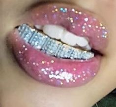 a woman's lips with glitter on them