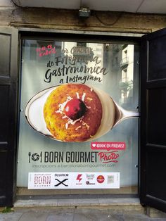 an advertisement on the side of a building for a pastry shop in paris, france