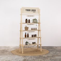 a wooden shelf with bottles and baskets on it in front of a wall that says your logo