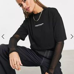 Crew Neck Crop Boxy Relaxt Fit Tee Logo Print On Chest Mesh Sleeve And Mesh Shirt Underneath Jersey: Soft And Stretchy Main: 100% Cotton, Inner: 100% Polyester. Body Length From Hps: 15.25" Chest (1" Below Armhole): 20" Neck Opening: 5.75" Neck Drop: 1.5" Nwot Layered Long Sleeve T Shirt, Black Shirts Women, Black Mesh Top, Layered Long Sleeve, Asos Tops, Layered T Shirt, Mesh Shirt, Mesh Sleeves, Mesh Long Sleeve