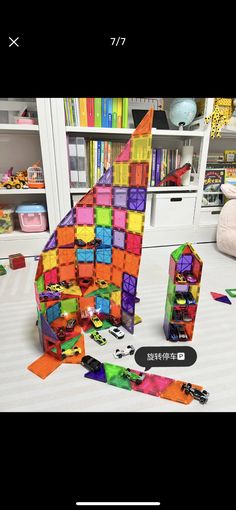 a skateboard is laying on the floor in front of a building made out of legos