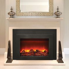 a fireplace with a mirror above it and rocks on the fire place next to it