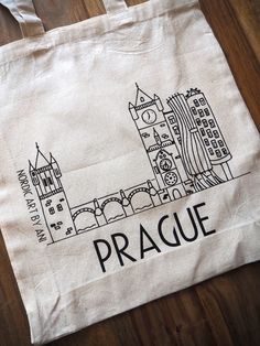 Reusable 100% cotton tote bag with handmade design of Prague Czech. The perfect tote can hold anything from books to groceries and it is durable enough to use over and over again.  And with its timeless minimalistic style it can be taken pretty much anywhere from school, the farmers market, a park or to the beach. Size 28 x 42 x 10 cm          14.9 x 16.5 x 3.9 inches Hand wash (20 oC / 68 oF) and iron inside out. Personalizations are possible, please contact me for more informations. Minimalistic Style, Prague Czech Republic, Prague Czech, Cotton Tote Bag, Handmade Design, Cotton Totes, Cotton Tote Bags, Prague, Farmers Market