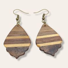 Our beautiful walnut inlay wood earrings are perfect for anyone who loves the outdoorsy look! The earrings are made with handcrafted inlay wood by Stanley, with copper ear wires and measure 2 1/4 inches long. Whether you want to show your Minnesota roots or just add a touch of nature to your style, these earrings are sure to be a favorite! Artisan Brown Wooden Earrings, Artisan Brown Wood Earrings, Brown Teardrop Wood Jewelry, Wood Dangle Earrings, Wood Inlay, Handcrafted Wood, Wood Earrings, Love At First Sight, Elevate Your Style