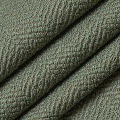 close up view of the texture of a green fabric