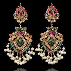 Imperial classics embodying the essence of celebration with richness of nauratan stones! Opt for opulence with stunning pair of earrings curated with breathtaking stone work and pearl moti emulating sheer class. Approximate earrings length is 3.5". Gold-plated on high-quality brass as base metal. Made by order. Kindly allow 5-7 weeks for the delivery of this item. For custom or urgent requests, please contact support@alacouture.com. *Please Note: The multi-colored beadwork might be slightly vary Festive Fusion Chandelier Earrings With Stone Work, Diwali Fusion Bridal Jeweled Earrings, Fusion Style Jeweled Bridal Earrings For Diwali, Fusion Jeweled Bridal Earrings For Diwali, Festive Fusion Jeweled Chandelier Earrings, Pearl Chandbali Temple Jewelry Earrings, Temple Jewelry Chandbali Pearl Earrings, Elegant Chandbalis With Latkans For Celebration, Elegant Chandbali Pearl Earrings With Latkans