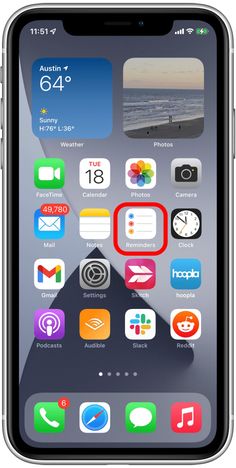 an iphone with the home screen showing icons and numbers on it's back side