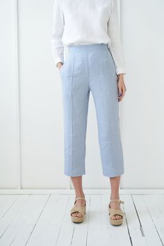 "TORI - finest pair of classic linen pants with a flat front for a polished look. FABRIC: 100% softened Lithuanian linen COLOR: Please choose a color on the side menu. STYLE: Cropped linen flat front pants with rubber at the back and side pockets. SIZE CHART (body measurements) : S Bust 31.5- 35\" (80- 88 cm) Waist 23- 26.5\" (59- 68 cm) Hips 35- 38\" (88- 96 cm) M Bust 35- 38\" (89- 96 cm) Waist 27- 30\" (69- 76 cm) Hips 38- 41\" (97- 104 cm) L Bust 38- 41\" (97- 104 cm) Waist 30.5- 33\" (77- 8 Linen Trousers With Welt Pockets, Straight Linen Pants With Pockets, Blue Wide Leg Linen Pants, Blue Linen Ankle-length Wide Leg Pants, Elegant Blue Linen Pants, Blue Linen Pants With Loose Fit, Blue Straight Hem Pants For Summer, Spring Linen Pants In Flax Color, Summer Linen Wide Leg Pants With Straight Hem