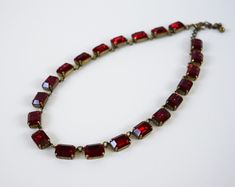 "*A limited selection of my jewelry is available on Etsy. To see my full inventory, please visit my website at www.damesalamode.com.* My MOST requested color! Rich, mysterious, and classic. Garnets have been prized for ages, but came into particular popularity in the 18th and 19th Centuries! These big crystals are vintage Swarovski. Beautifully faceted and wonderfully rich and sparkling! Stone Size: 14x10mm / .55 inches / 1.4cm each Stones: Vintage Swarovski Garnet Crystals Settings: Cast brass Luxury Red Necklaces For Formal Occasions, Vintage Red Garnet Necklace, Formal Red Jeweled Necklaces, Elegant Red Garnet Necklaces, Elegant Red Garnet Necklace, Red Ruby Necklace For Evening, Elegant Red Single Strand Necklace, Formal Red Single Strand Necklace, Elegant Red Single Strand Jewelry