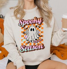 Ghost Sweatshirt Women Halloween Spooky Season Retro Shirt Cute Boo Shirt Ghost Sweater Peace Sign Shirt Crewneck Long Sleeve 80s Sweater Ghost Sweatshirt for Women Celebrate spooky season in style with our retro Ghost Sweatshirt. This cute Boo shirt features a peace sign ghost design, perfect for Halloween. The crewneck long sleeve sweatshirt has an 80s-inspired look, combining comfort and vintage charm. Ideal for adding a playful touch to your Halloween wardrobe. DETAILS: - Ideal for any situa Ghost Sweater, Peace Sign Shirts, Retro Ghost, Ghost Sweatshirt, Boo Shirts, 80s Sweater, Ghost Design, Women Halloween, Sweatshirt Women