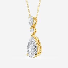 A celebration of smooth curves and sharp edges, this hinged pear shape diamond pendant radiates with effortless elegance. A solitaire lab grown pear shaped diamond creates a beautiful reflection against a smaller pear shaped and round diamond, promoting the elongating effect of this refined shape. Style this pendant on its own for a subtle sparkle or make it the most beautiful part of your layered look. Elegant Pear-shaped Drop Necklace For Formal Occasions, Elegant Teardrop Drop Necklace For Formal Occasions, Timeless Pear-shaped Diamond Necklace For Wedding, Pear-shaped Cubic Zirconia Diamond Necklace For Formal Occasions, Fine Jewelry Pear-shaped Drop Necklace For Formal Events, Elegant Pendant Drop Necklace With Brilliant Cut, Luxury Pear-shaped Drop Necklace For Wedding, Formal Pear-shaped Cubic Zirconia Diamond Necklace, Elegant Pear-shaped Diamond White Necklace