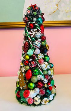 a christmas tree made out of ornaments and candy canes