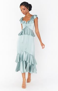 Feminine and flirty, this silver sage ruffled tiered midi dress is as romantic as they come. The ruffles and flutter sleeves make this dreamy dress the utmost flattering, and smocked back ensures the perfect fit. Slate Blue Bridesmaid Dresses, Satin Ruffle Dress, Mint Green Bridesmaid Dresses, Ruffles Bridesmaid Dresses, Teal Bridesmaid, Teal Bridesmaid Dresses, Silver Bridesmaid Dresses, Sage Bridesmaid Dresses, Formal Wedding Guest Dress