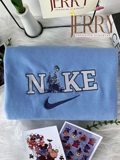 the nike logo is on top of a blue bag and two pictures are next to it