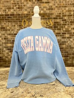 Delta Gamma Sweatshirt Collegiate Spring Tops With Ribbed Cuffs, Spring Collegiate Tops With Ribbed Cuffs, Collegiate Style Top With Ribbed Cuffs For Spring, Collegiate Spring Crew Neck Tops, Collegiate Crew Neck Tops For Spring, Spring Collegiate Crew Neck Tops, Winter Fan Apparel Tops With Ribbed Cuffs, Collegiate Style Relaxed Fit Top With Ribbed Cuffs, Relaxed Fit Collegiate Tops With Ribbed Cuffs