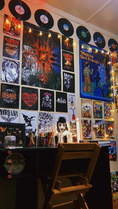 a room filled with lots of records on the wall