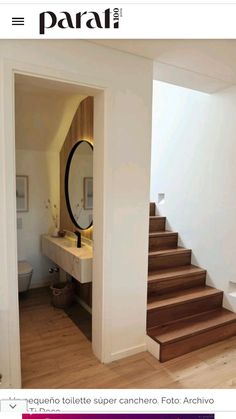 there is a mirror and some stairs in this house