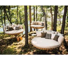 an image of a couch in the woods with pillows on it's back end