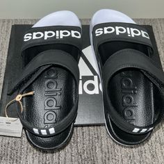 Adidas Black/White Sandals Women’s Size 6 Nwt Black Adidas Logo Sandals, Adidas Casual Synthetic Sandals, Adidas Black Synthetic Sport Sandals, Summer Black Adidas Sandals, Adidas Sandals With Logo, Synthetic Material, Black Adidas Sandals For Summer, Casual White Adidas Sandals, Adidas White Sport Sandals, White Adidas Sport Sandals