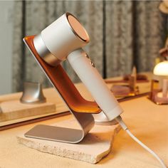 A functional and stylish storage solution for your Zuvi Halo hair dryer. Diffuser Styling, Healthy And Shiny Hair, Hair Dryer Stand, Heat Damaged Hair, Dryer Stand, Countertop Organization, Hair Dryer Holder, Halo Hair, Stylish Storage Solutions