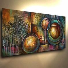 a painting hanging on the wall in a room