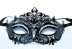 This is a gorgeous combination for his and hers masquerade masks. One is Silver and black which we put a dash of black glitter and silver around the eyes also sealed it with a beautiful silver trim! Part of the pair is beautiful laser cut metal mask with beautiful crystals and a black ribbon. I will combine a his and hers mask from any of my masquerade masks that fit both! I can combine my machine embroidered masks too that I make and change any color of my machine embroidered masquerade masks. Black Eye Mask For Masquerade, Black Masquerade Mask For Halloween Wedding, Elegant Black Mask For Costume Party, Black Gothic Eye Mask For Masquerade, Gothic Black Eye Masquerade Mask, Black Formal Masquerade Mask For Halloween, Black Formal Eye Mask Masquerade, Elegant Black Masquerade Mask For Halloween, Elegant Black Masks And Prosthetics For Party