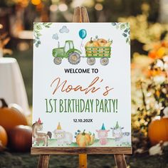 a sign that says welcome to noah's 1st birthday party in front of pumpkins