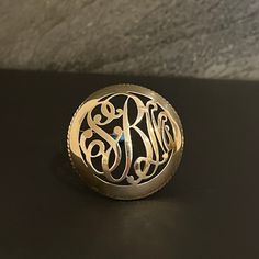 Vintage Sterling Monogram Pin Brooch NOTE: Needs polishing. Can also be sold polished at buyer's request. Material: Sterling Stamped: Sterling Diameter: 2 in. (50mm) (approx.) Approximate Height: 10mm Weight: 18 grams Initials: SBM Vintage Condition. Please take a good look at pictures as they are part of the description. I do my best to accurately describe the item and any flaws it may have. Personalized Silver Lapel Pin As Gift, Personalized Silver Lapel Pin Gift, Personalized Silver Lapel Pin For Gift, Silver Medallion Brooches As A Gift, Gold Round Pins For Anniversary, Elegant Personalized Silver Brooches, Personalized Silver Pins For Anniversary, Gold Hallmarked Round Brooches, Gold Round Hallmarked Brooches