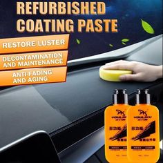 two bottles of soap sitting on the dashboard of a car with an ad for refreshed coating paste