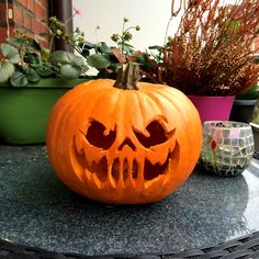 a carved pumpkin sitting on top of a table