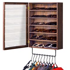 an open wooden shoe rack with many pairs of shoes hanging from it's sides