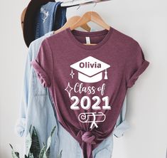 "Achiever Graduation T-Shirt, Graduation Personalized Shirt, Family Graduation Shirt, Class Of 2021 Shirt, Senior Custom Shirt, Senior Grad Welcome to my store :) I am so glad to see you here. I make my t-shirts with love. I am sure you will like them. Please make sure you check the size chart before ordering. Unisex size is fit for men but a little loose for women. If you want to have a fitter look, you can select one size smaller. The inscriptions on the T-shirts are black in light colors and Cotton Letter Print Top For Graduation, Relaxed Fit Crew Neck Top For Graduation, Cotton Crew Neck Top For Graduation, Custom Print Cotton Tops For Graduation, Graphic Tee Crew Neck For Graduation, Custom Print Crew Neck Shirt For Graduation, Memory Shirt, Graduation Shirts For Family, Degree Gift