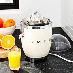 Smeg Pink Citrus Juicer + Reviews | Crate and Barrel Smeg Cream, Retro Refrigerator, Kitchen Tech, Electric Juicer, Citrus Juicer, Crate Barrel, Chrome Metal, Eating Raw, Metal Accents