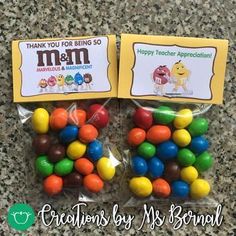 two bags of m & m chocolate candies on a counter with the words thank you for being so m and m