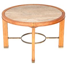 a round wooden table with metal legs and a marble top on an isolated white background