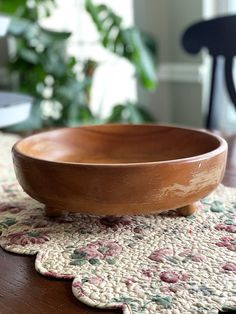 a bowl sitting on top of a wooden table