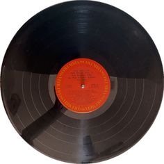 an old black record with orange label on it