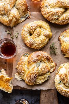 freshly made bagels and honey on a cutting board